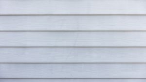 A white painted timber clad wall