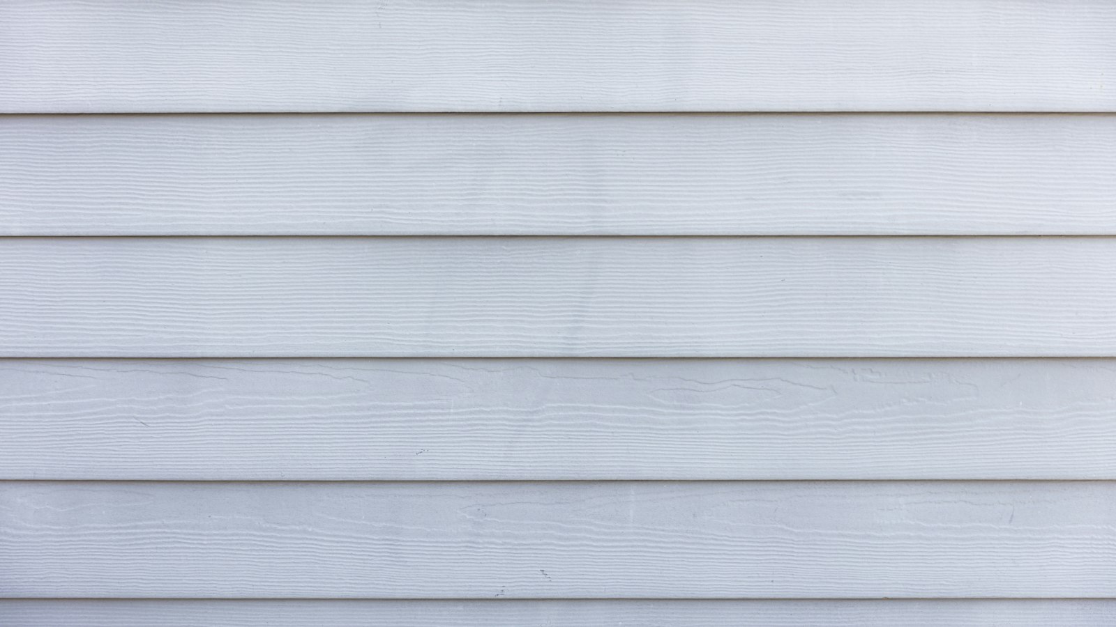 A white painted timber clad wall