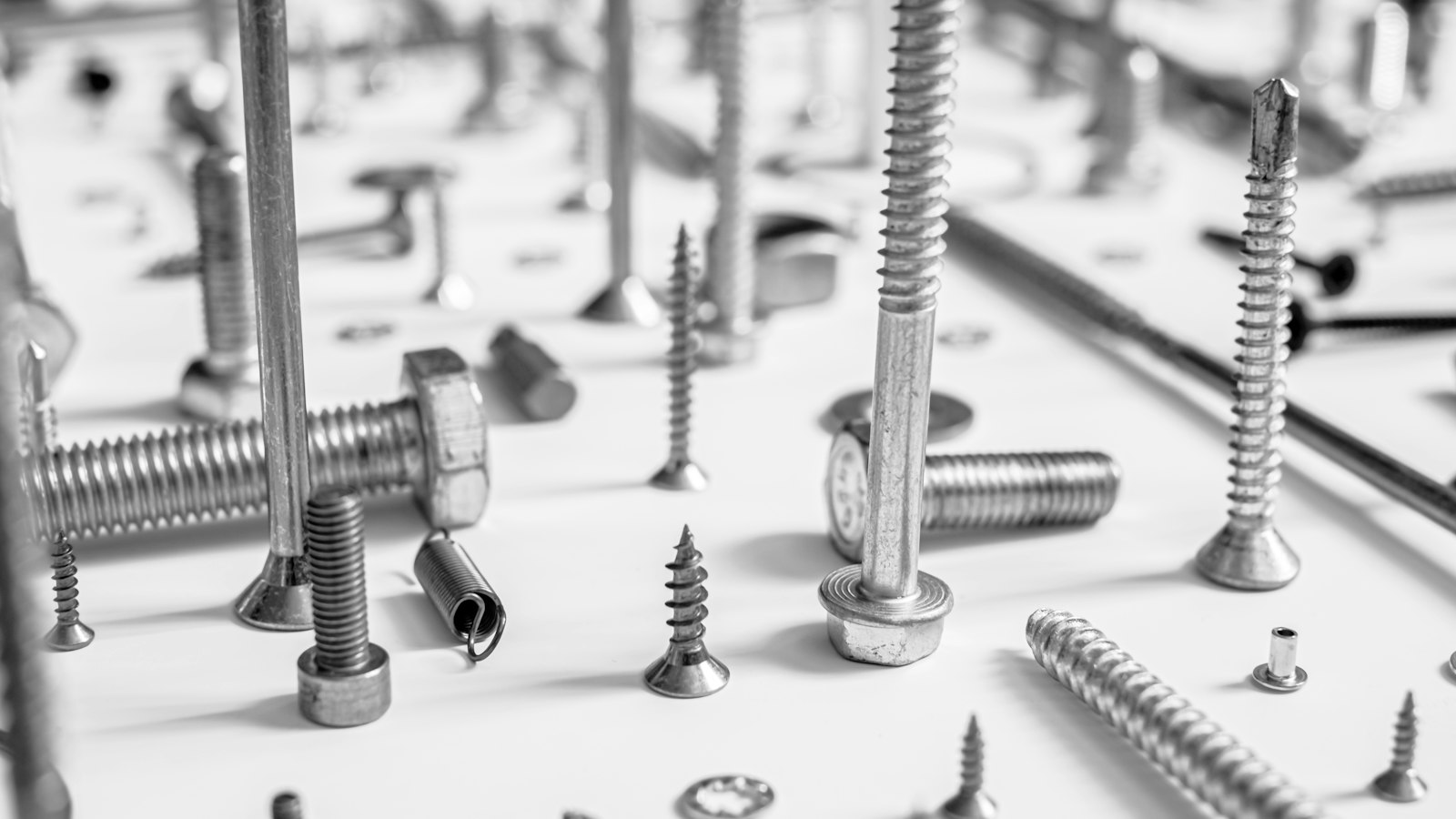 A pile of screws on a work surface