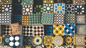A display of patterned ceramic tiles in many designs