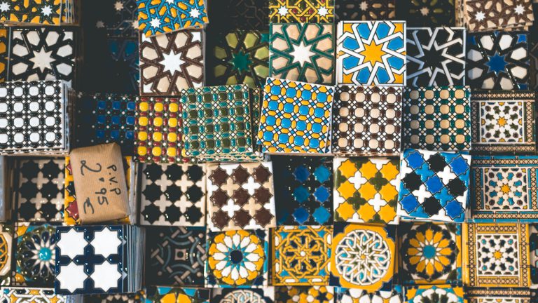 A display of patterned ceramic tiles in many designs