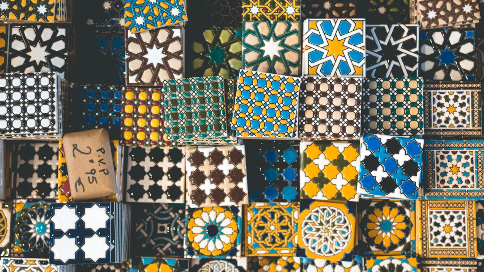 A display of patterned ceramic tiles in many designs